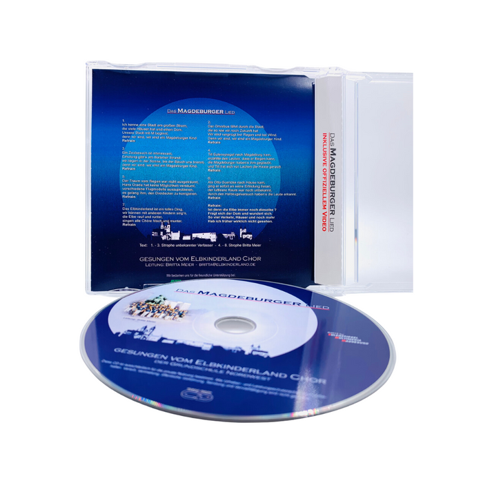 CD 'Magdeburger Lied' mit einem blauen Cover auf einer Hülle, präsentiert vom Elbkinderland Chor. Die CD selbst zeigt den Titel und enthält das offizielle Video. Ideal für Fans von Kinderchormusik und Magdeburg.